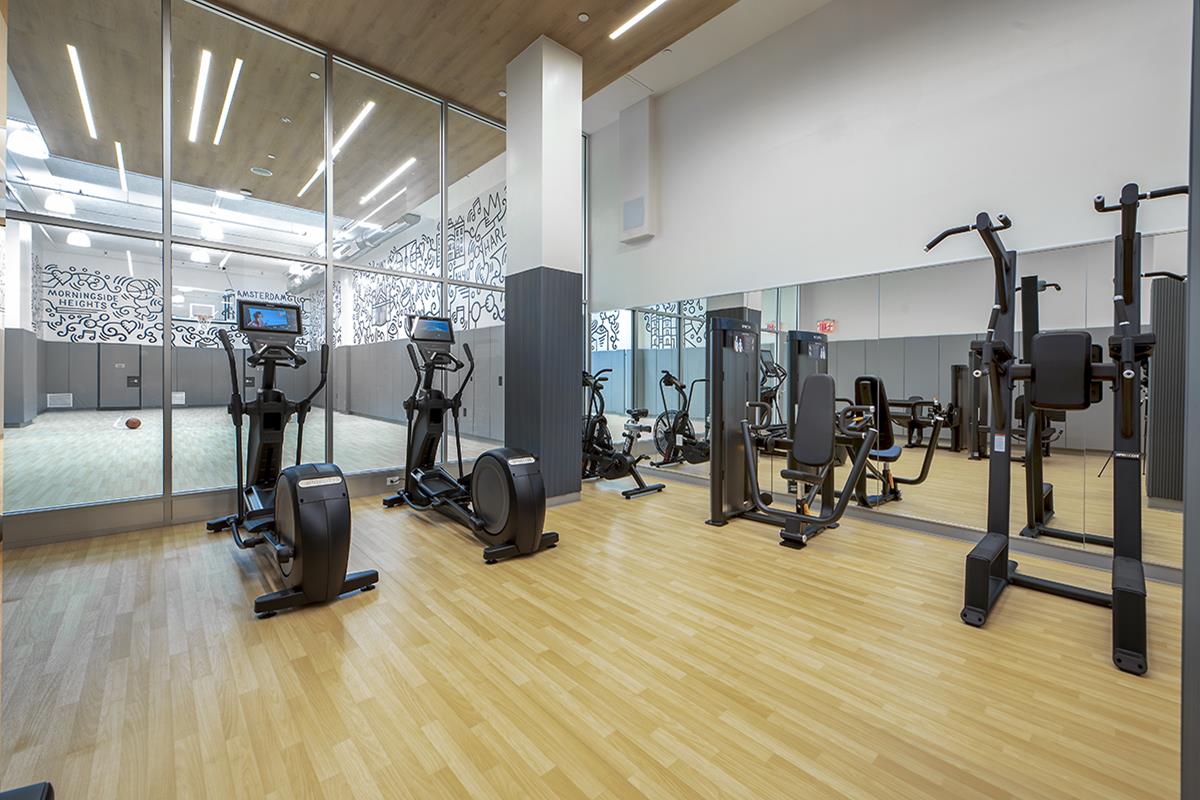 1440 Amsterdam Avenue, Unit 1212 Manhattan, NY 10027 - Photo 8 of 21 a view of a room with gym equipment