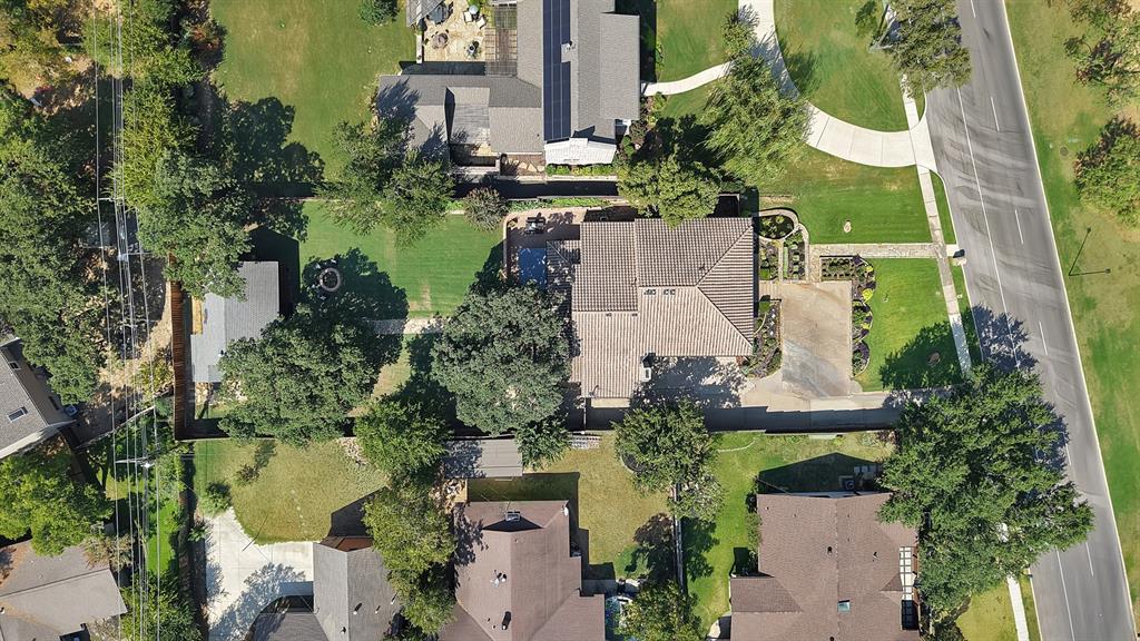 306 Rochelle Boulevard Irving, TX 75062 - Photo 38 of 40 Aerial view showcasing multiple residences with mature landscaping, manicured lawns, and established trees throughout the neighborhood