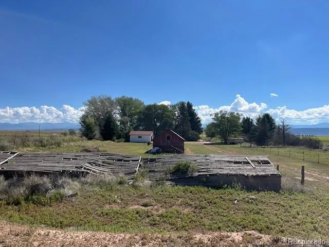 a view of a backyard with water fountain
