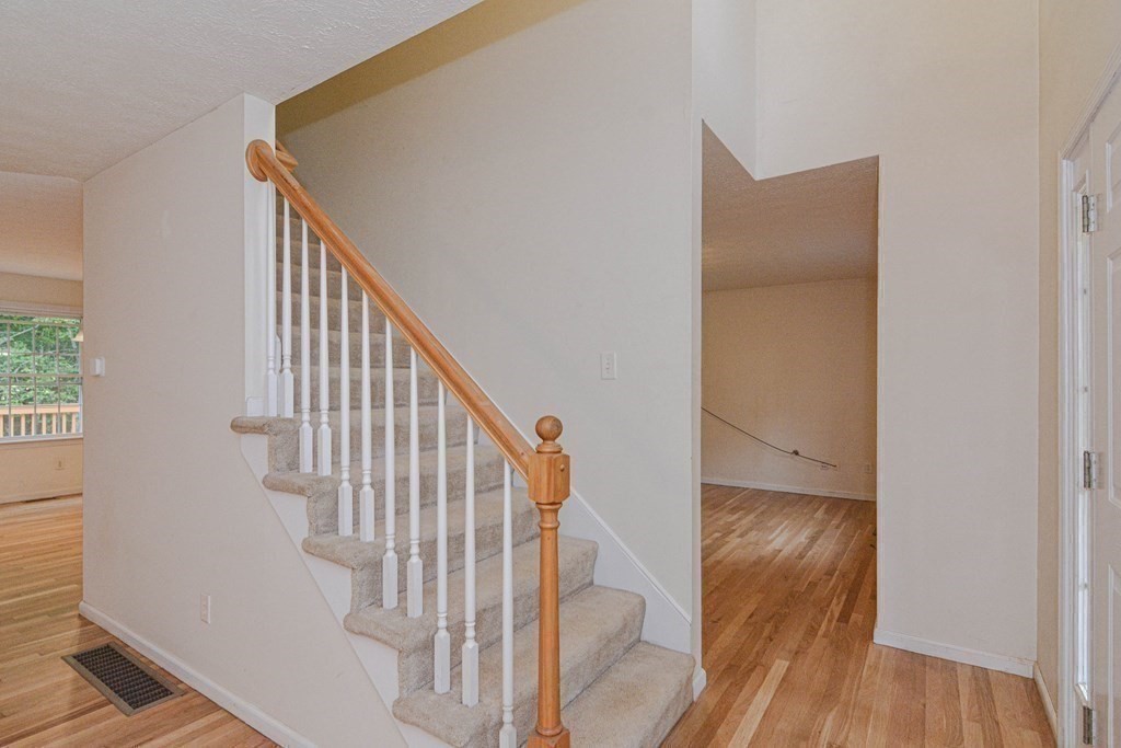 21 Shore Drive Upton, MA 01568 - Photo 14 of 29 a view of staircase with wooden floor and white walls