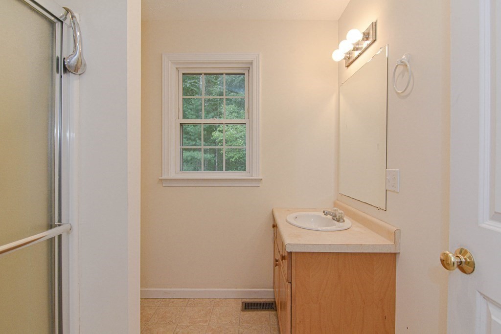 21 Shore Drive Upton, MA 01568 - Photo 19 of 29 a bathroom with a sink a toilet and shower