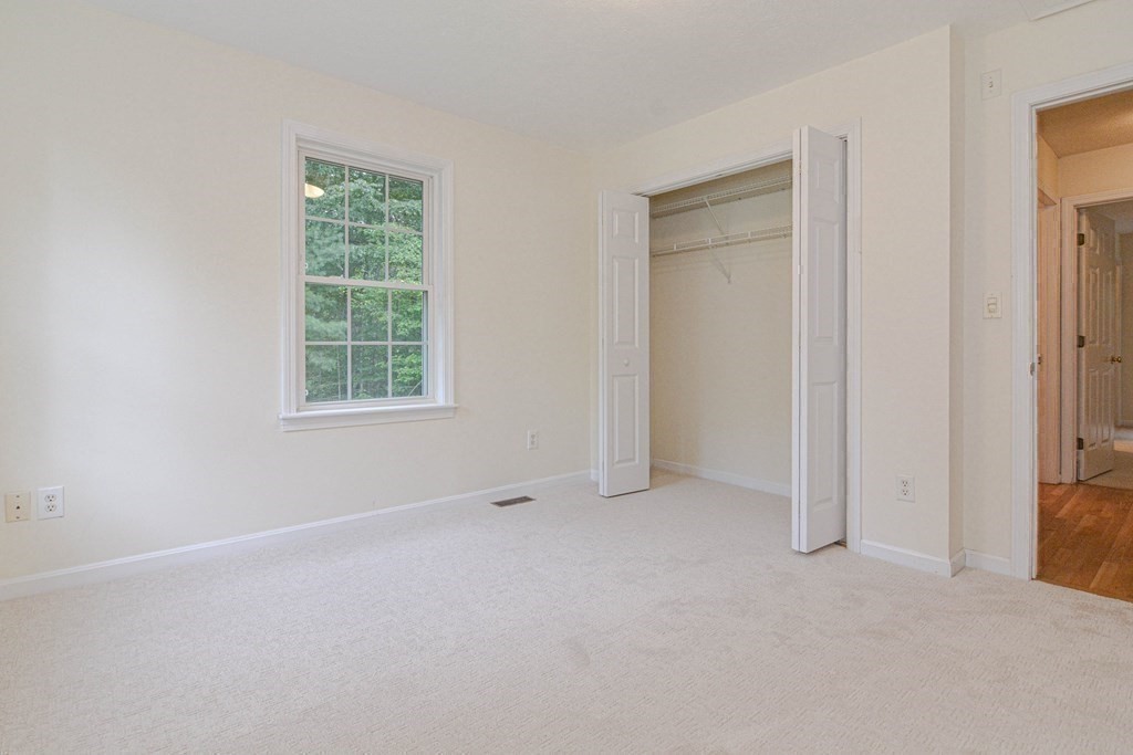 21 Shore Drive Upton, MA 01568 - Photo 22 of 29 an empty room with windows and closet