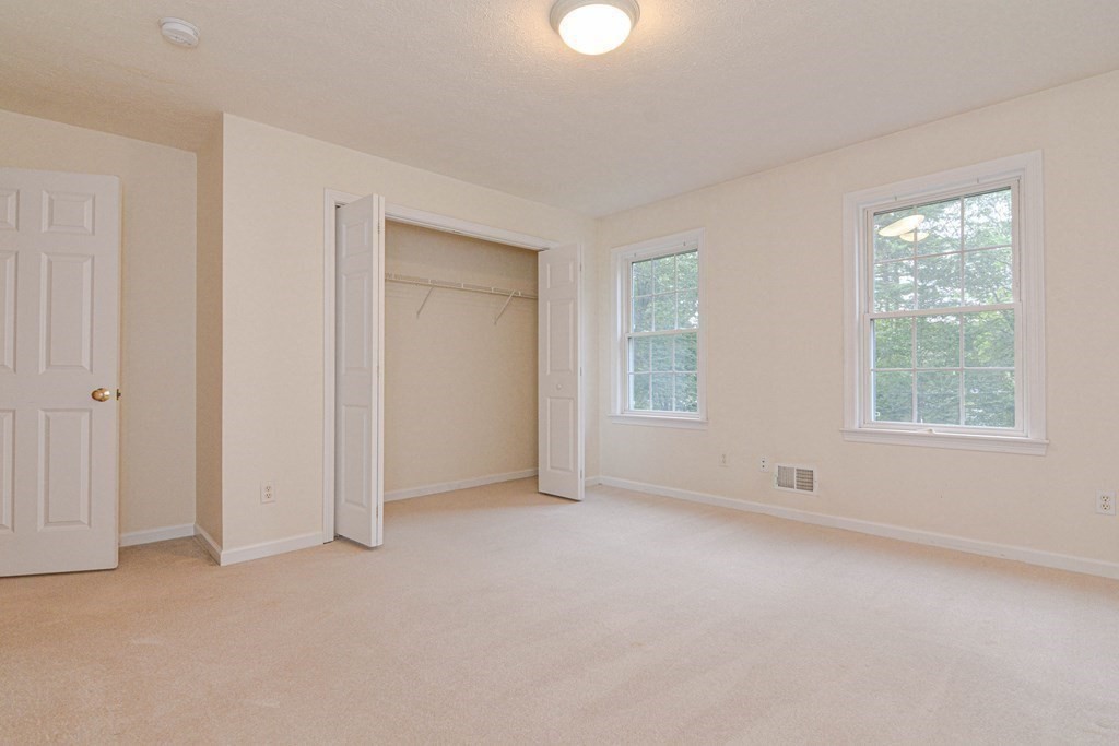 21 Shore Drive Upton, MA 01568 - Photo 23 of 29 an empty room with windows and closet
