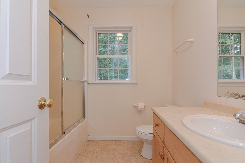 21 Shore Drive Upton, MA 01568 - Photo 25 of 29 a bathroom with a sink a toilet and shower