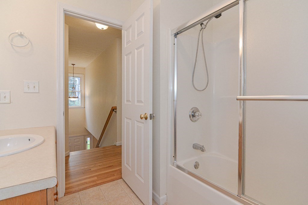 21 Shore Drive Upton, MA 01568 - Photo 26 of 29 a bathroom with a shower and a bath tub