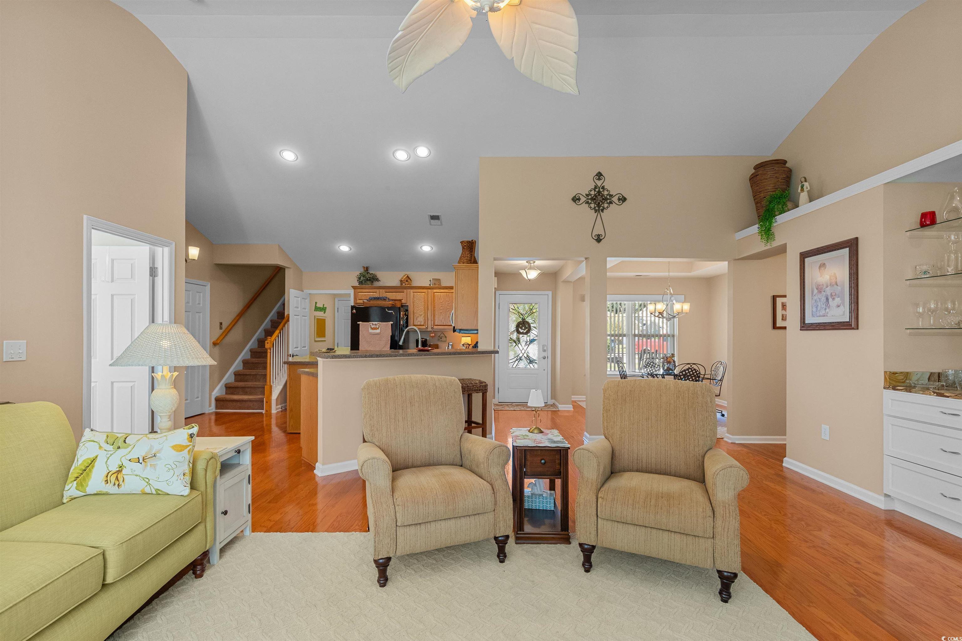 3505 Arrowhead Boulevard Myrtle Beach, SC 29579 - Photo 8 of 40 Living area with light wood-type flooring, stairway, recessed lighting, high vaulted ceiling, and ceiling fan