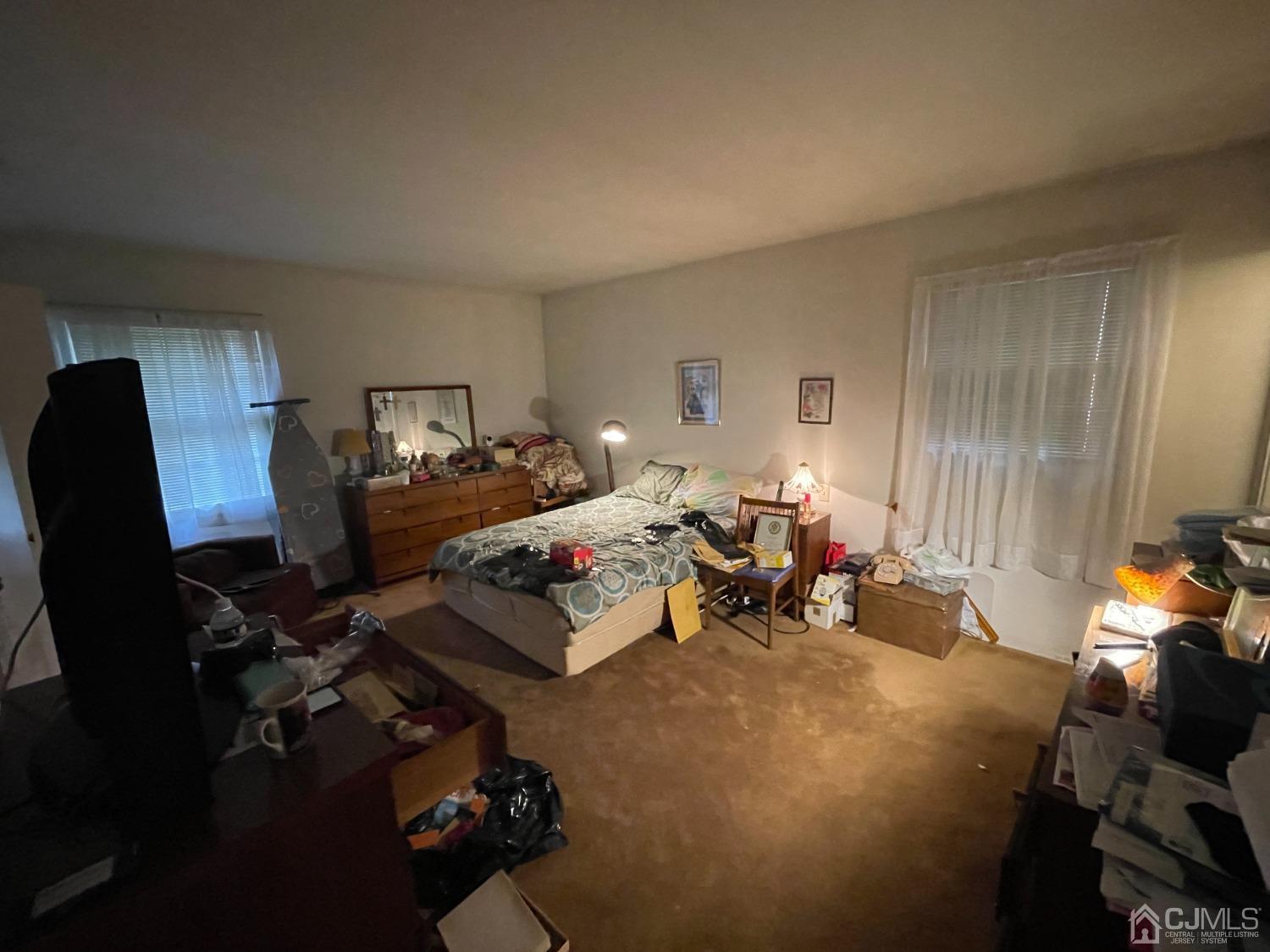 22 Abbott Road Somerset, NJ 08873 - Photo 11 of 15 a bed room with furniture and a lamp