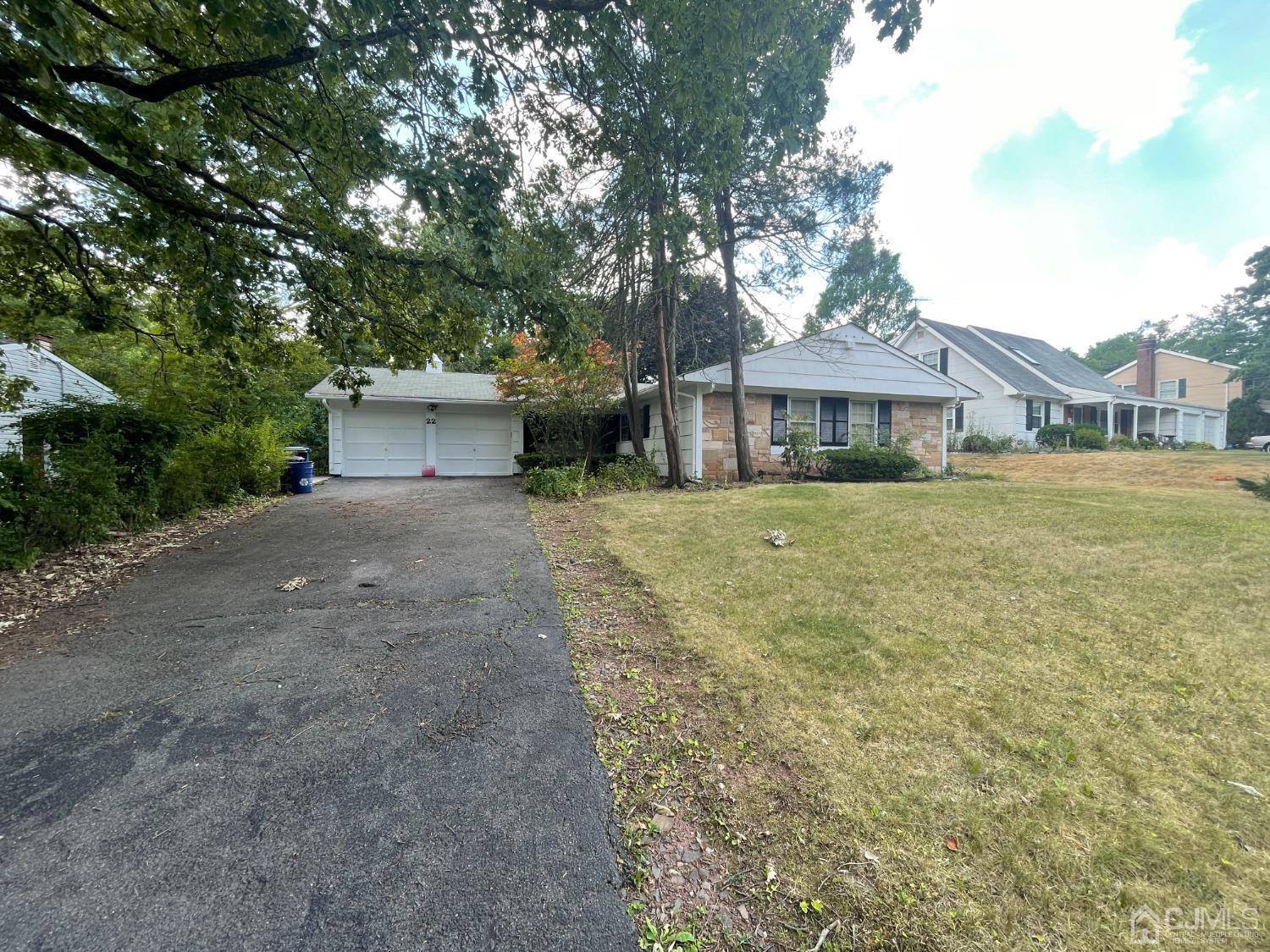 22 Abbott Road Somerset, NJ 08873 - Photo 2 of 15 a front view of a house with a yard and trees