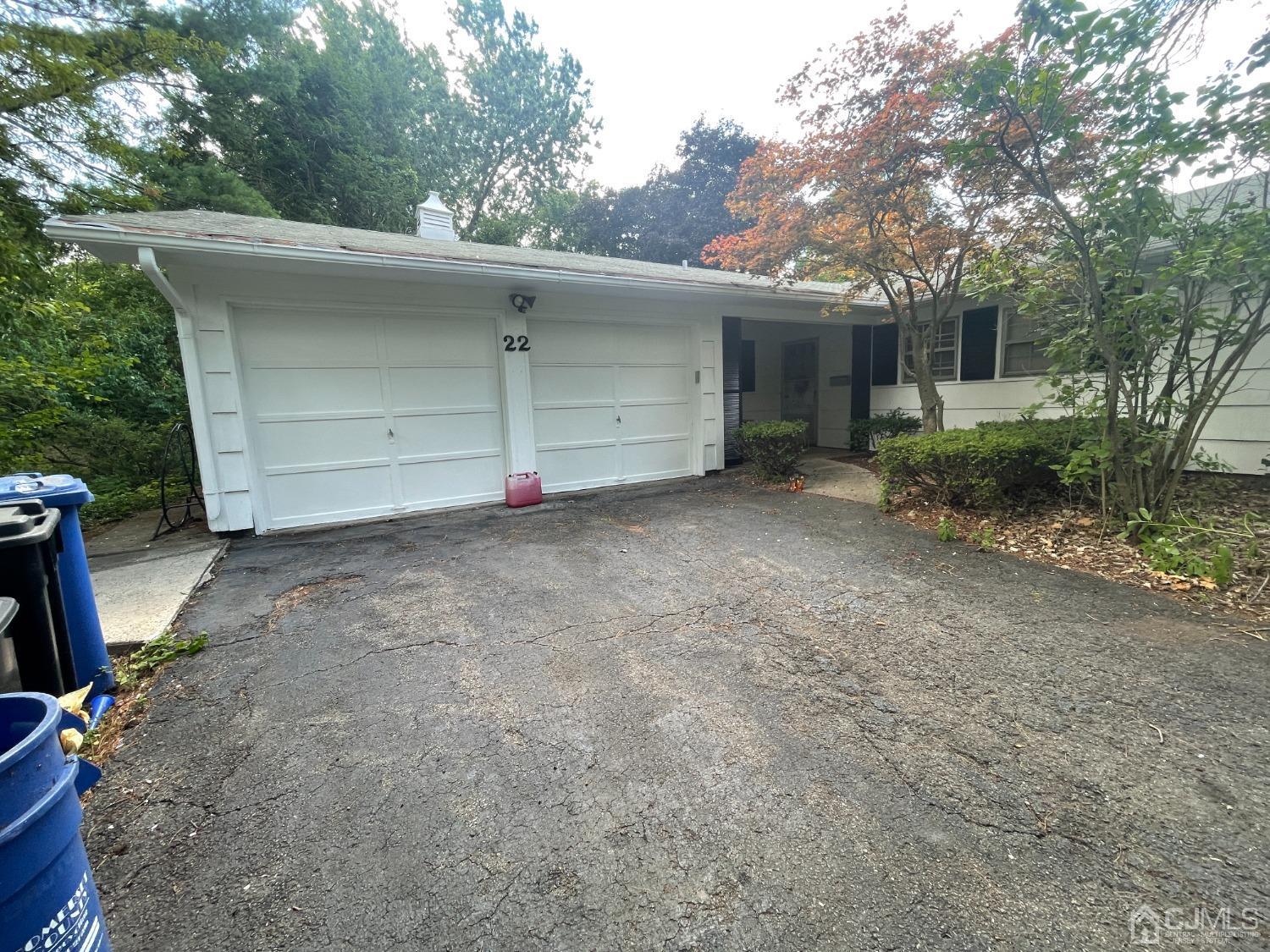 22 Abbott Road Somerset, NJ 08873 - Photo 3 of 15 a view of a house with a backyard and garage