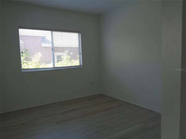 a bathroom with a sink toilet and window