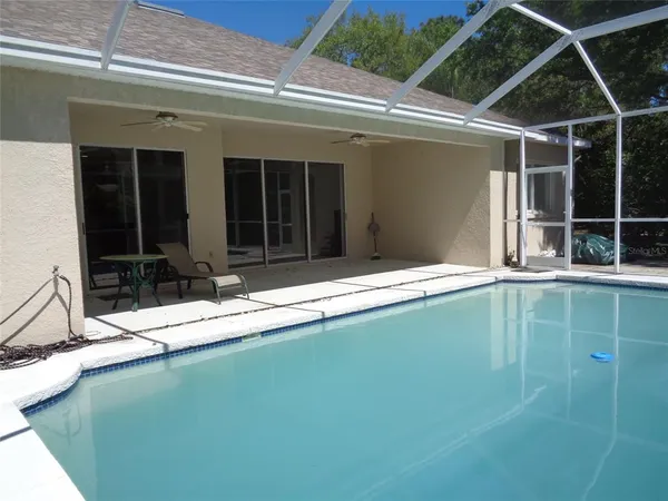 a view of a backyard of the house