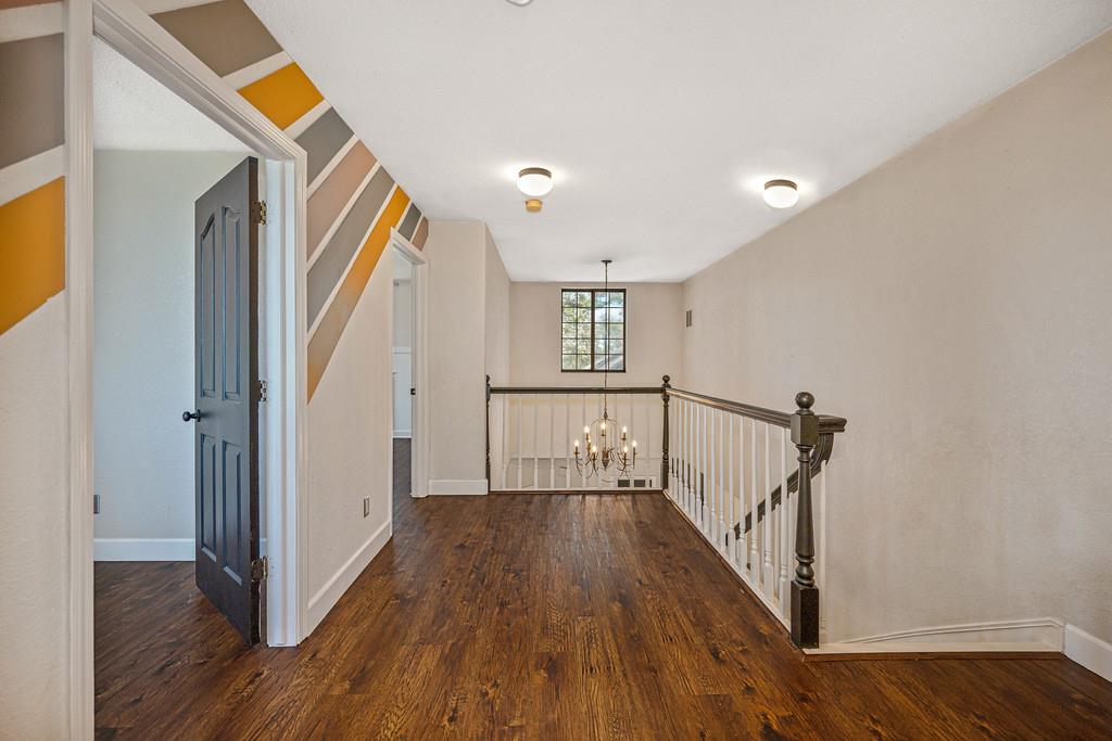 3154 Twin K Road Pilot Hill, CA 95664 - Photo 54 of 89 a view of a hallway with wooden floor and staircase