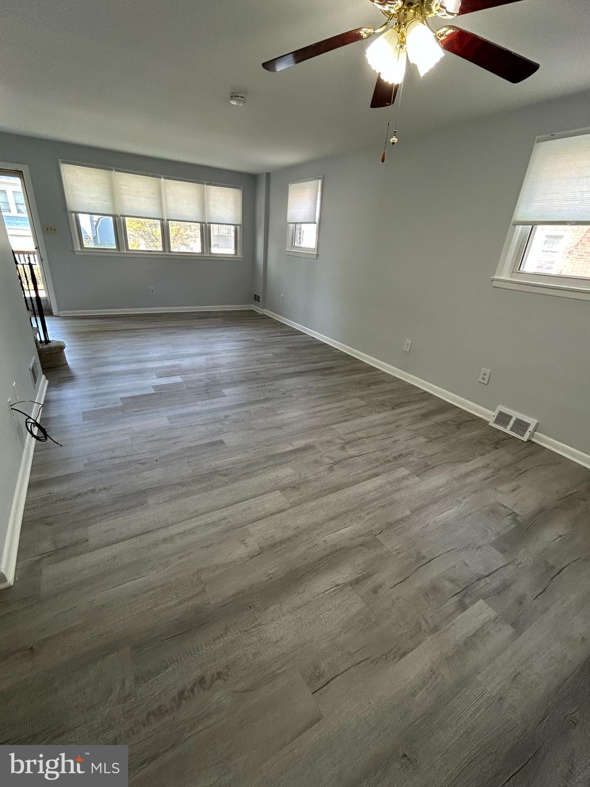 15 East Avon Road Brookhaven, PA 19015 - Photo 2 of 9 wooden floor in an empty room with a window