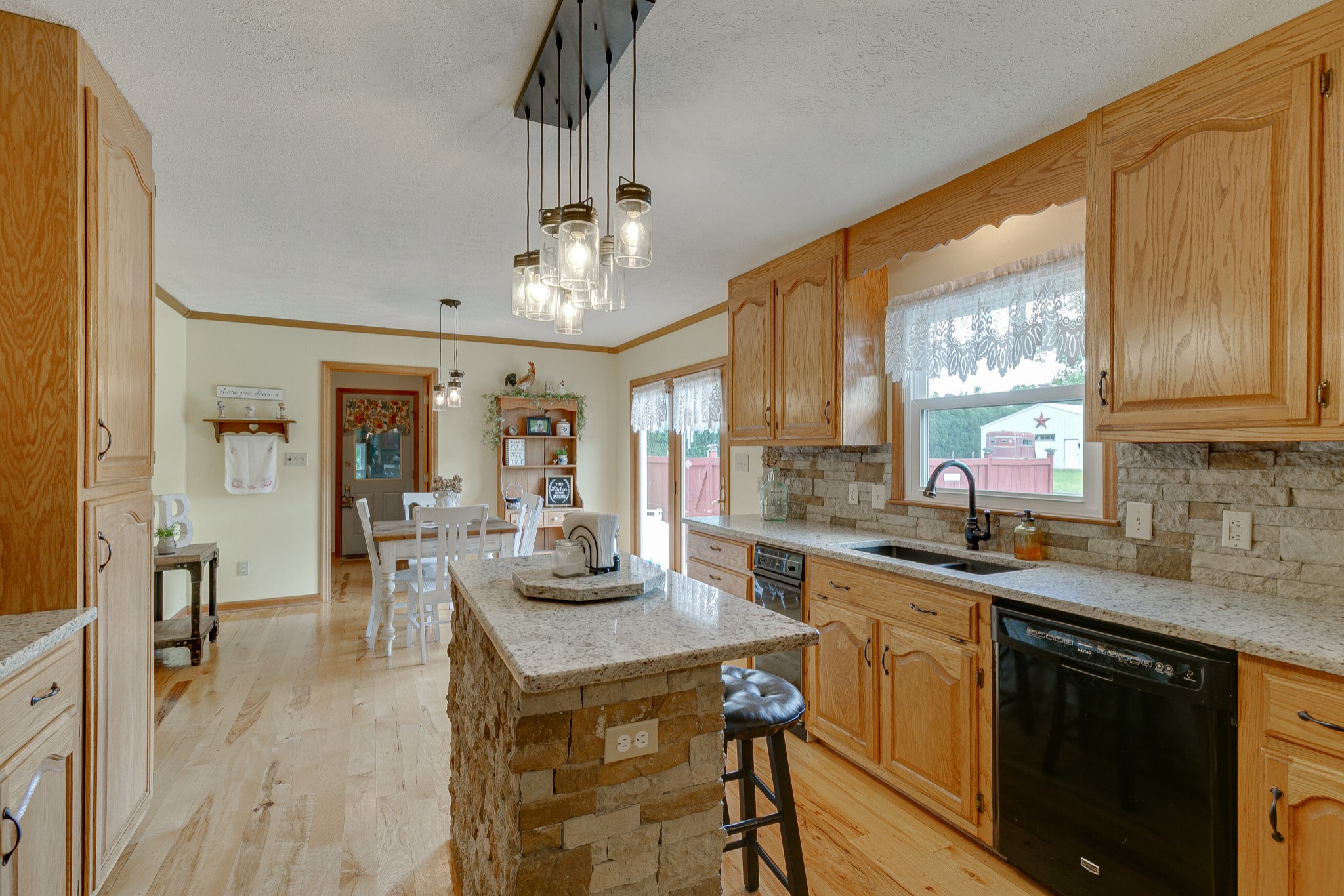 1872 Clara Mathis Road Spring Hill, TN 37174 - Photo 11 of 40 a kitchen with stainless steel appliances granite countertop a sink stove and refrigerator