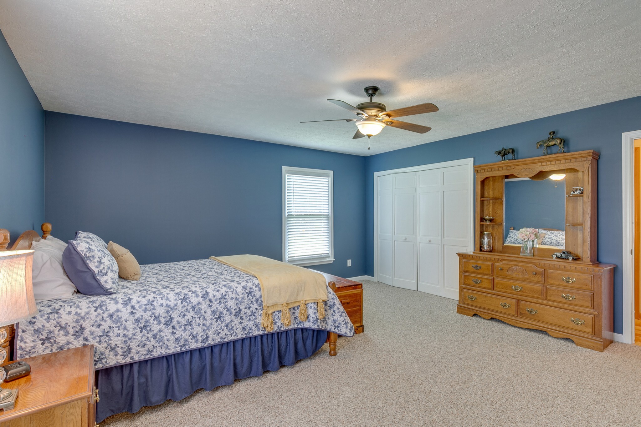 1872 Clara Mathis Road Spring Hill, TN 37174 - Photo 15 of 40 a bedroom with a bed a chandelier and dresser