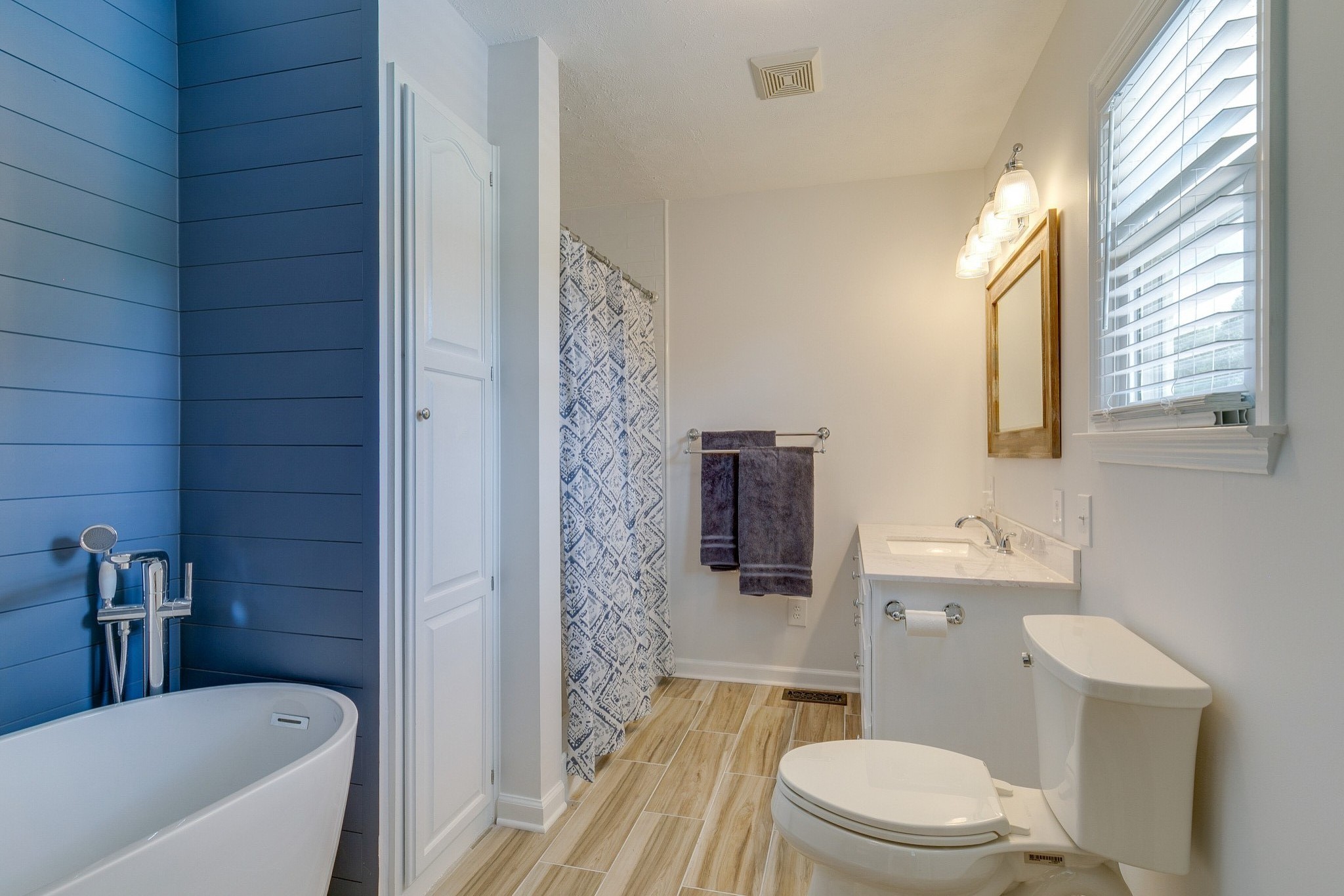 1872 Clara Mathis Road Spring Hill, TN 37174 - Photo 17 of 40 a bathroom with a toilet a sink a mirror a bathtub and shower