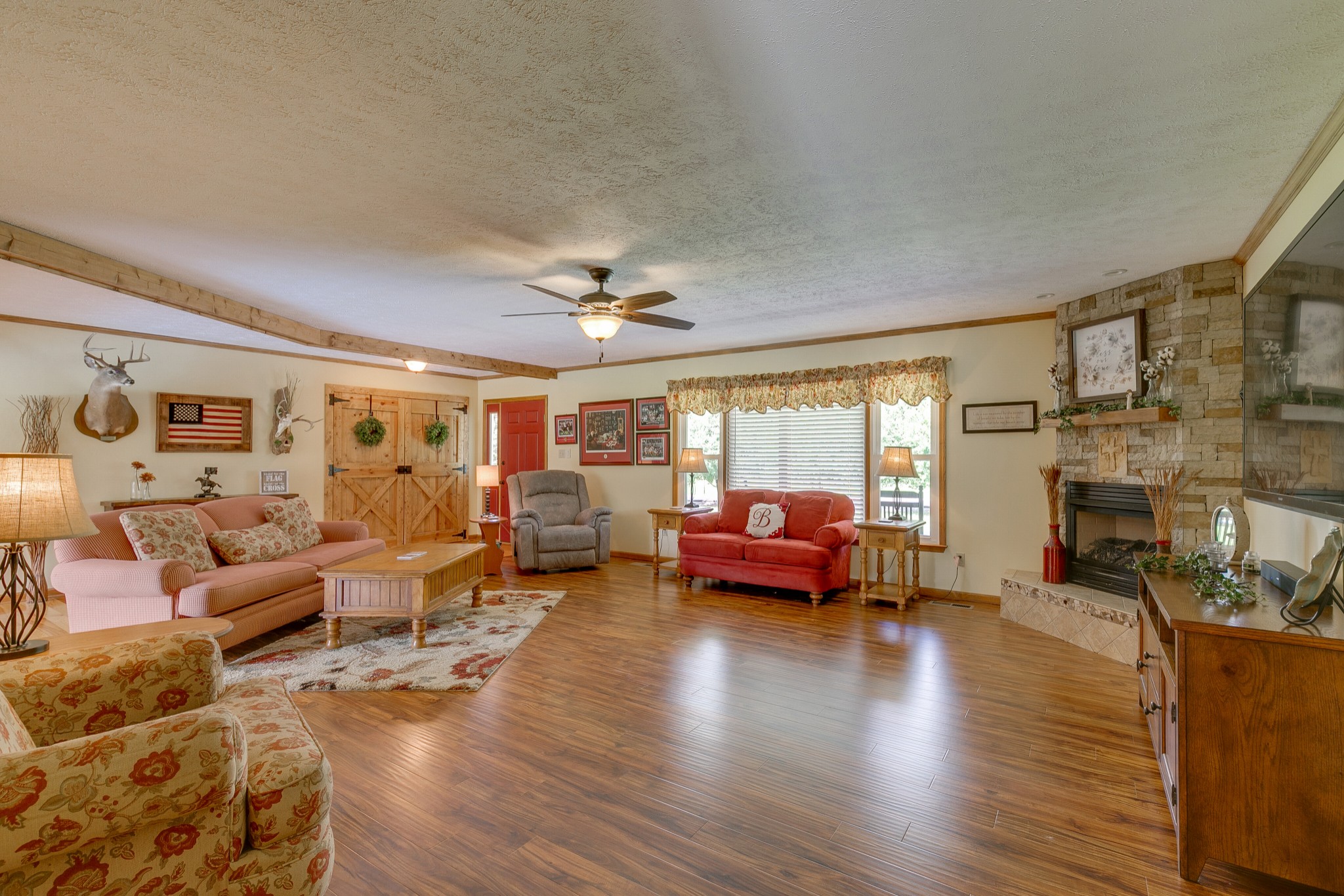 1872 Clara Mathis Road Spring Hill, TN 37174 - Photo 5 of 40 a living room with fireplace furniture and a wooden floor