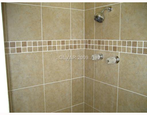 328 Huntly Road Las Vegas, NV 89145 - Photo 7 of 11 Master Bath/Spa. New Sink, Toilet, and Granite Counter Tops in This Master Bathroom!