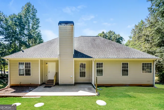 a front view of house with yard and green space