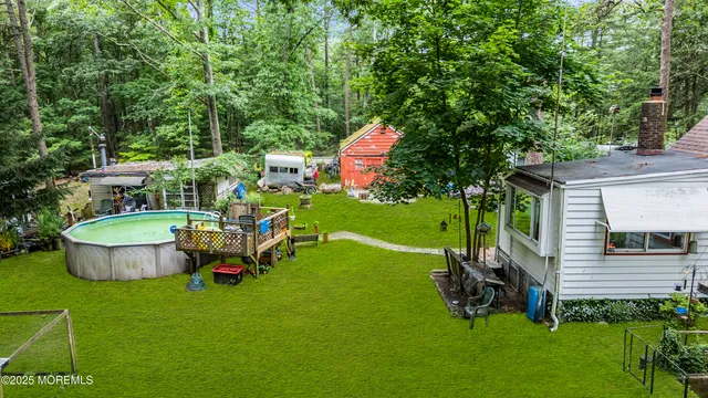 a view of a backyard with plants and a patio
