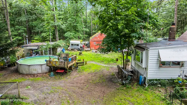 a view of a house with backyard sitting area