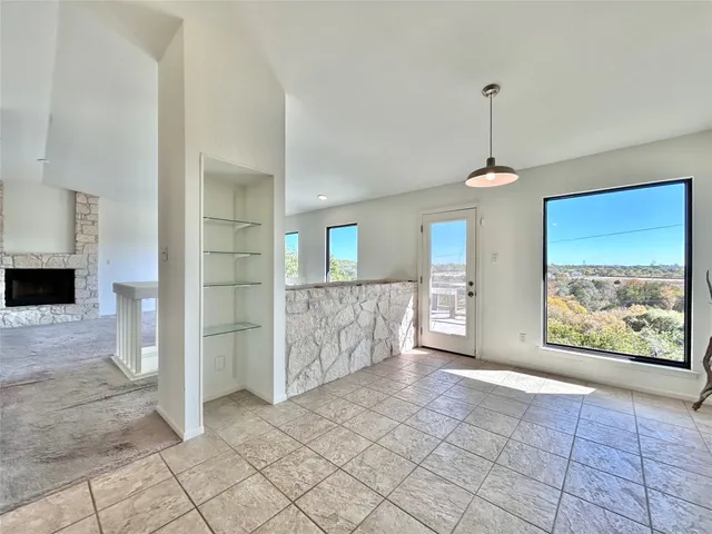 a large kitchen with stainless steel appliances a cabinets and a counter top