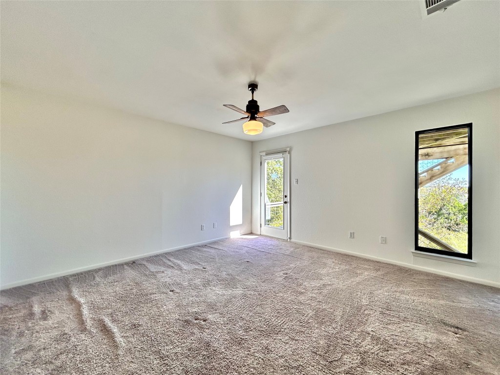 11205 Terrace Bluff Drive Austin, TX 78754 - Photo 16 of 37 a view of an empty room with a window