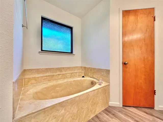 a bathroom with a bathtub