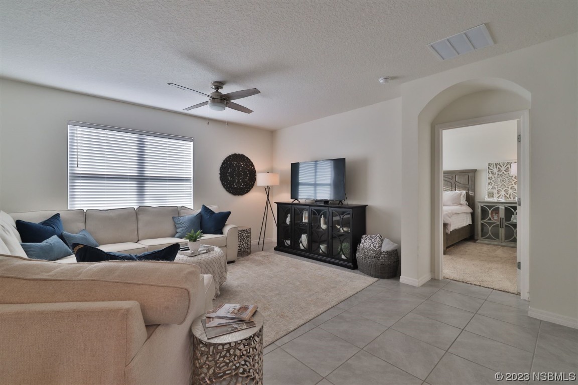 421 Anne Street DeLand, FL 32724 - Photo 12 of 44 a living room with furniture and a large window