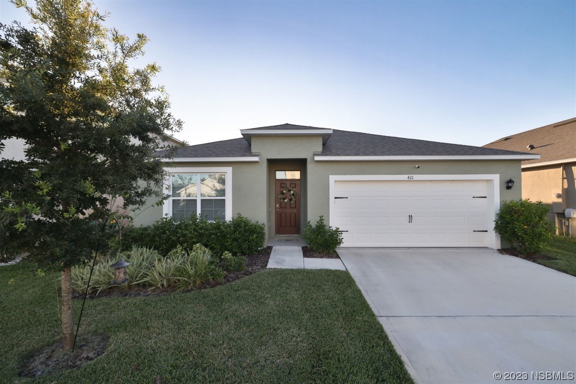 421 Anne Street DeLand, FL 32724 - Photo 2 of 44 a front view of house with yard and green space