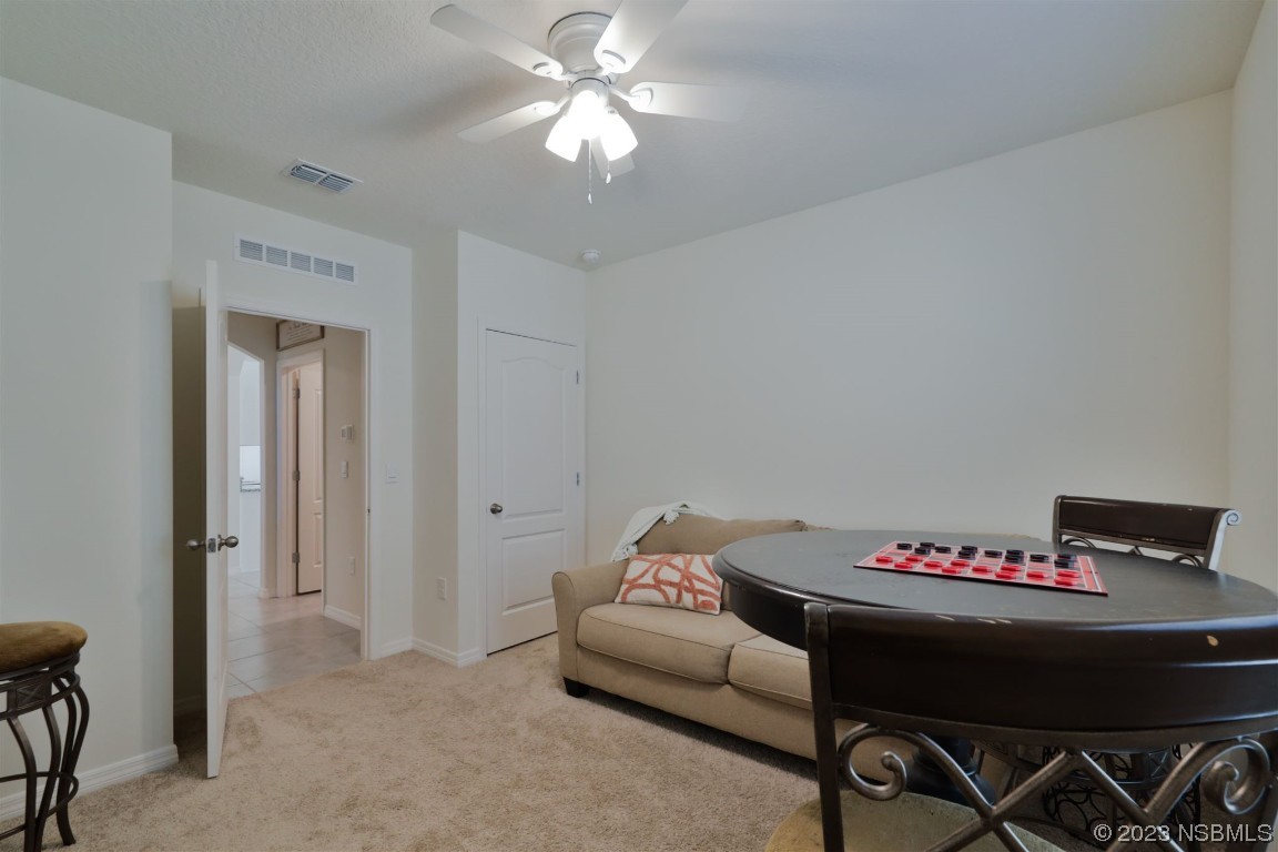 421 Anne Street DeLand, FL 32724 - Photo 22 of 44 a workspace with furniture and chandelier
