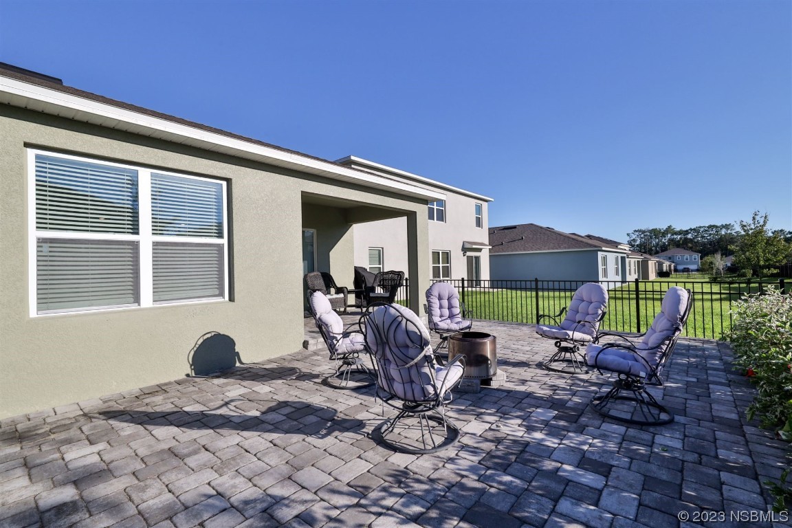 421 Anne Street DeLand, FL 32724 - Photo 26 of 44 a backyard of a house with yard and outdoor seating