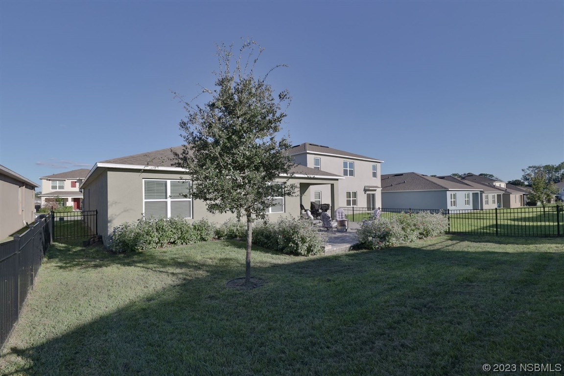 421 Anne Street DeLand, FL 32724 - Photo 27 of 44 a front view of a house with garden
