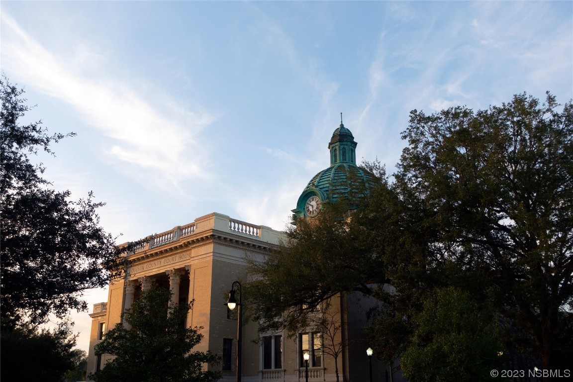 421 Anne Street DeLand, FL 32724 - Photo 38 of 44 a view of a house with a tree and a yard