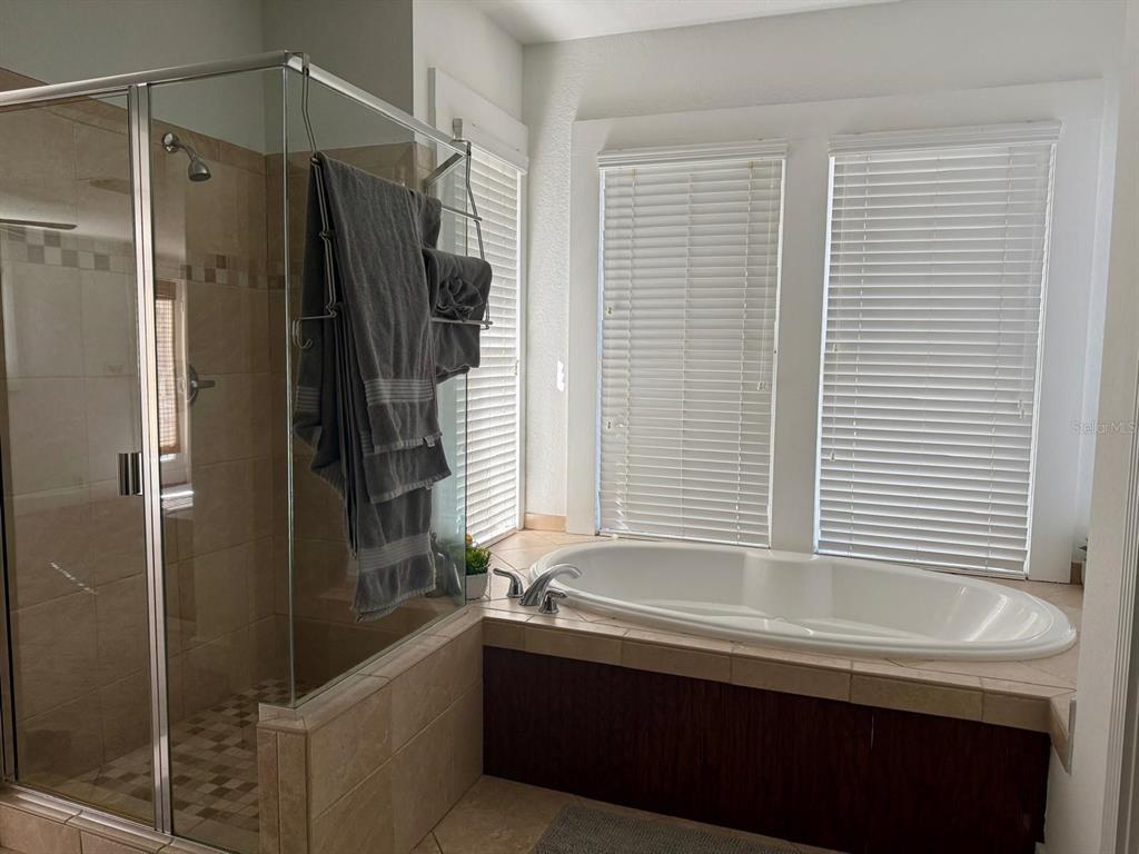 910 Southeast 2nd Street Ocala, FL 34471 - Photo 6 of 15 a bathroom with a bathtub and a shower