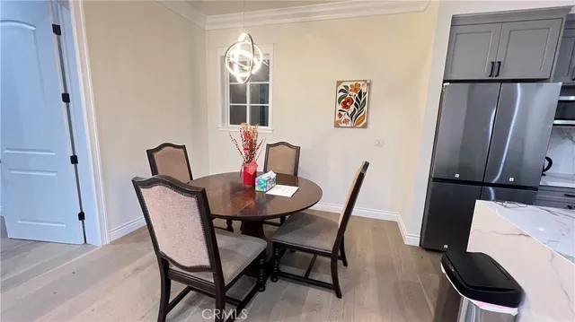 a view of a dining room with furniture and window