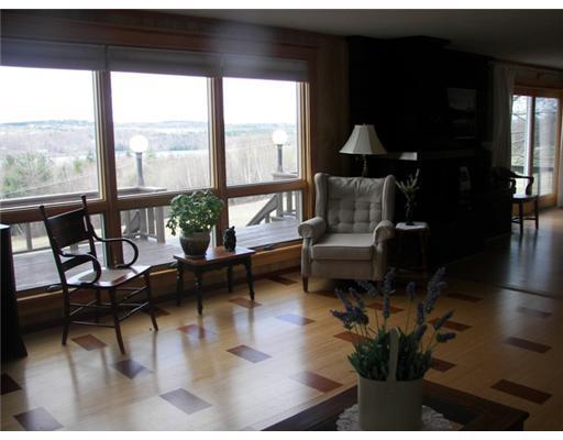 76 Metcalf Road Winthrop, ME 04364 - Photo 9 of 25 Living Room. Open, light, and what view!