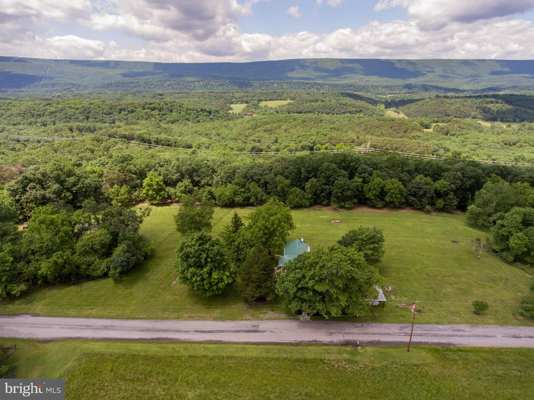 2902 Timber Ridge Road Berkeley Springs, WV 25411 - Photo 3 of 30 a view of lake with green space