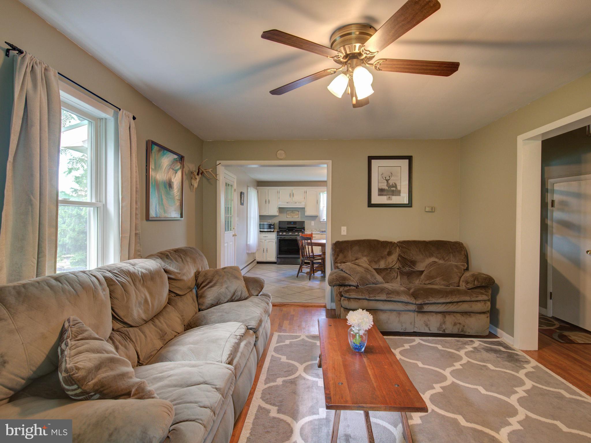 2902 Timber Ridge Road Berkeley Springs, WV 25411 - Photo 8 of 30 a living room with furniture and a window