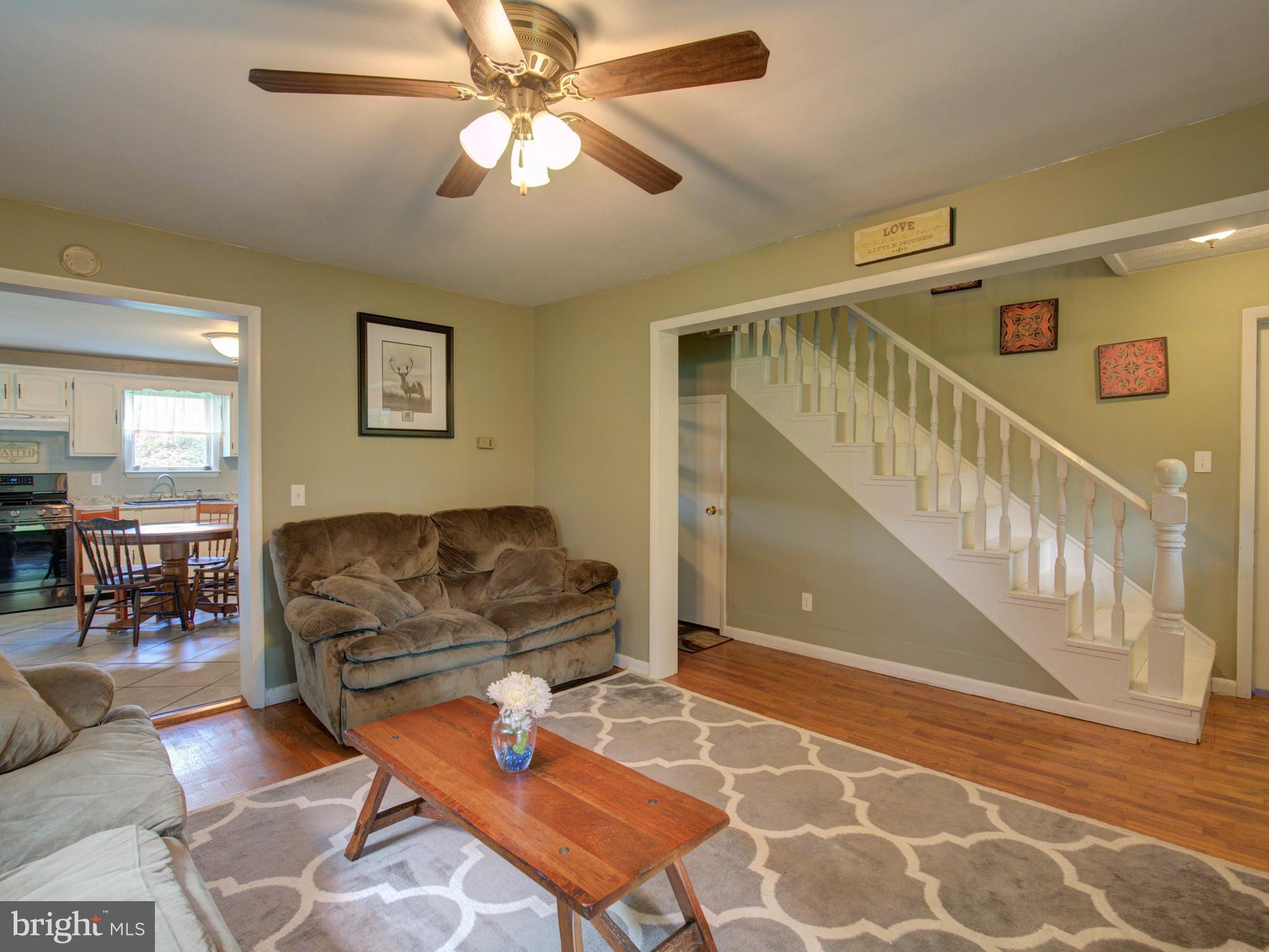 2902 Timber Ridge Road Berkeley Springs, WV 25411 - Photo 9 of 30 a living room with furniture and a rug