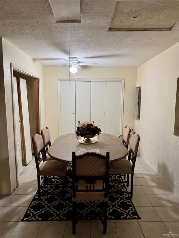 3813 North Taylor Road Mission, TX 78573 - Photo 12 of 29 a view of a dining room with furniture and wooden floor