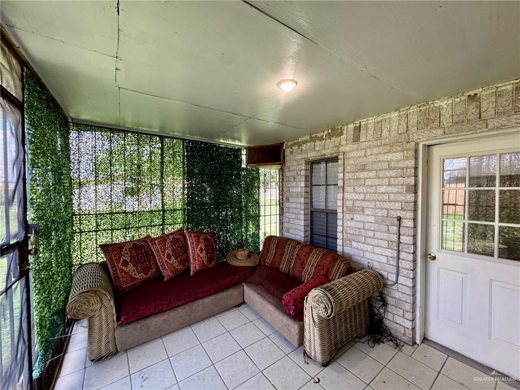 3813 North Taylor Road Mission, TX 78573 - Photo 19 of 29 a living room with furniture and a large window