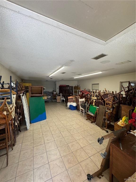 3813 North Taylor Road Mission, TX 78573 - Photo 21 of 29 a view of a garage with a bike and white walls