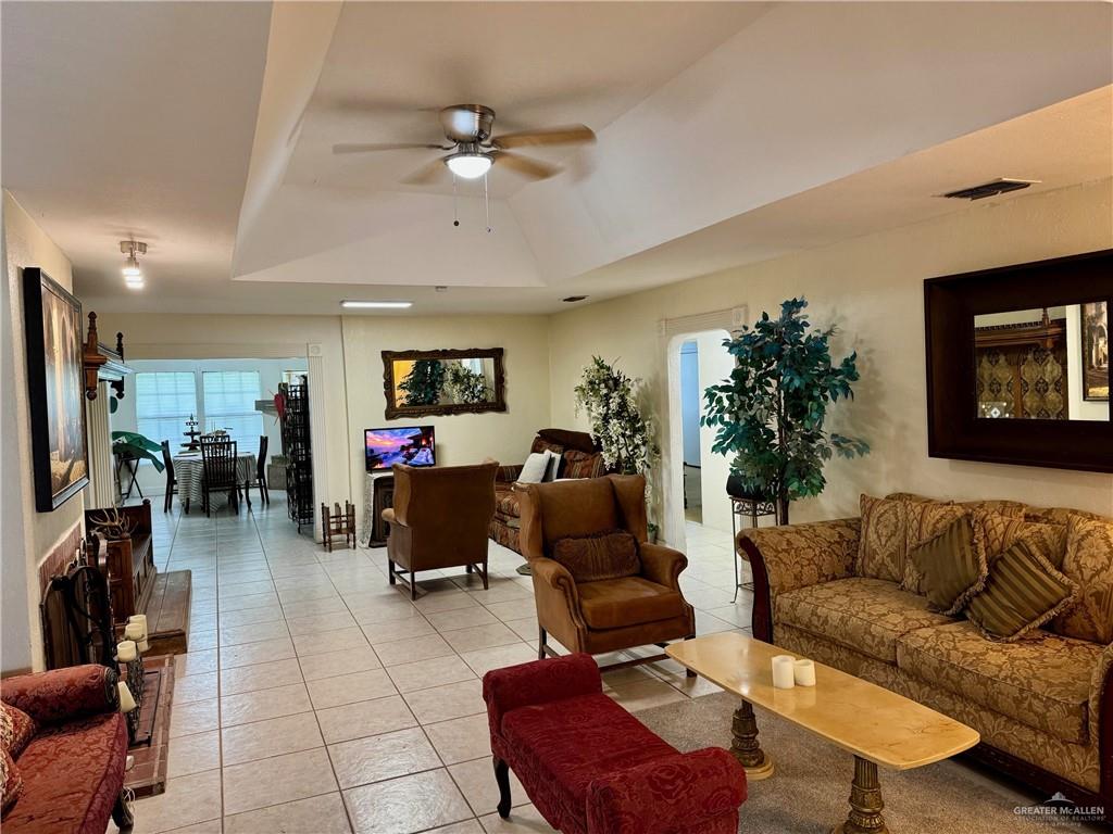 3813 North Taylor Road Mission, TX 78573 - Photo 8 of 29 a living room with furniture and a flat screen tv