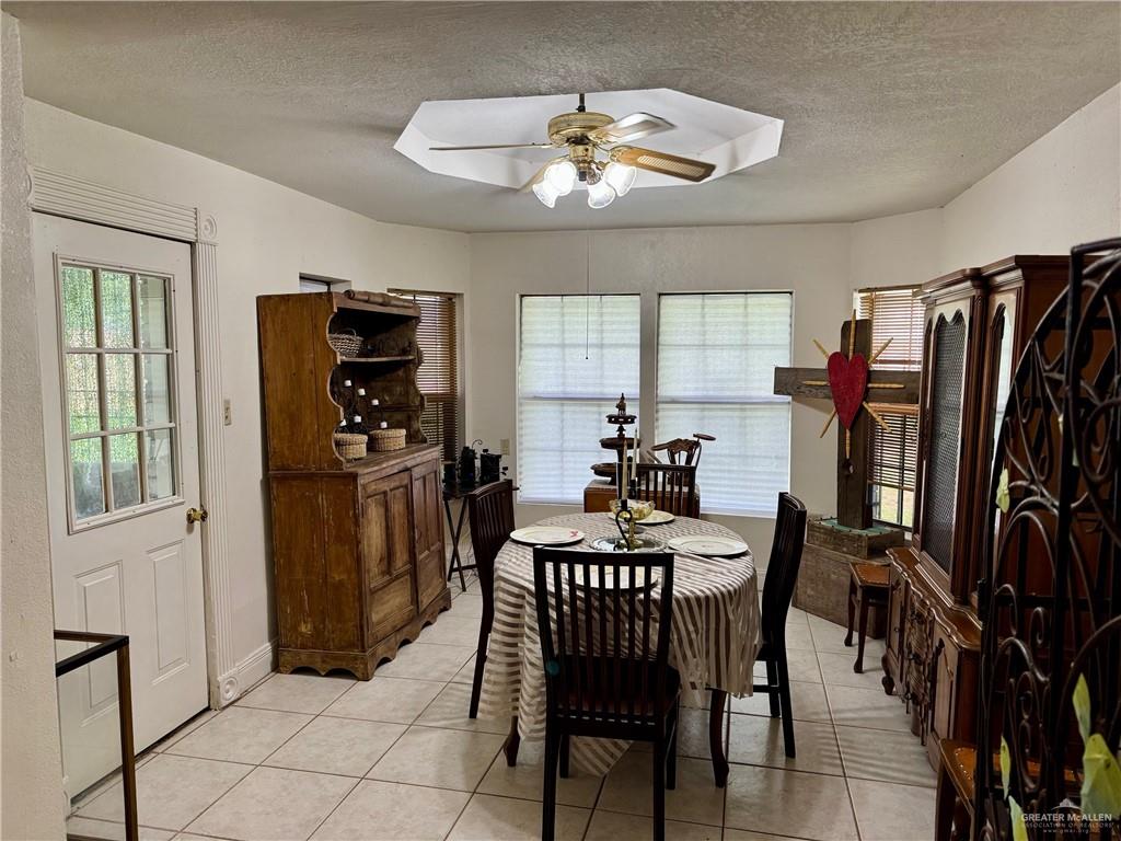3813 North Taylor Road Mission, TX 78573 - Photo 10 of 29 a dining room with furniture and window