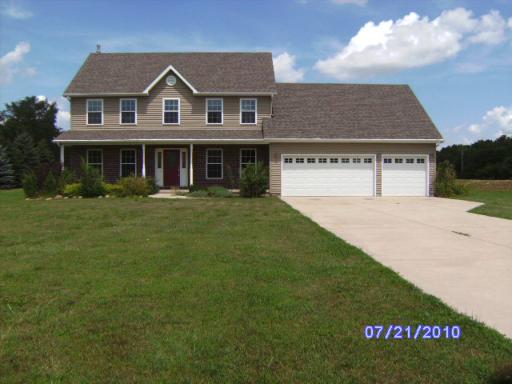 20 Grandin Road Morris, IL 60450 - Photo 1 of 1 a front view of a house with a garden