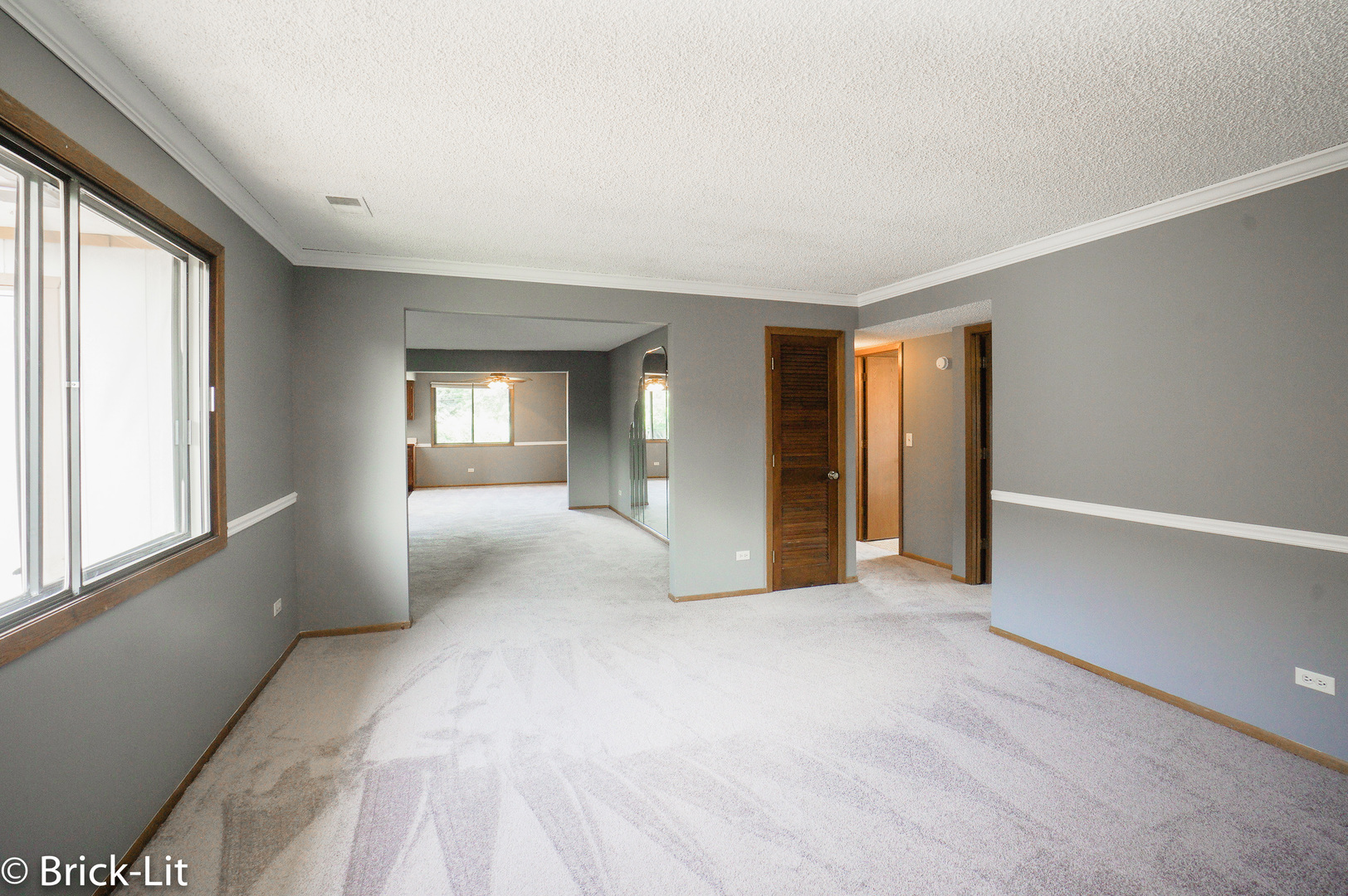19444 Wolf Road, Unit 3 Mokena, IL 60448 - Photo 12 of 18 a view of an empty room with window and a kitchen