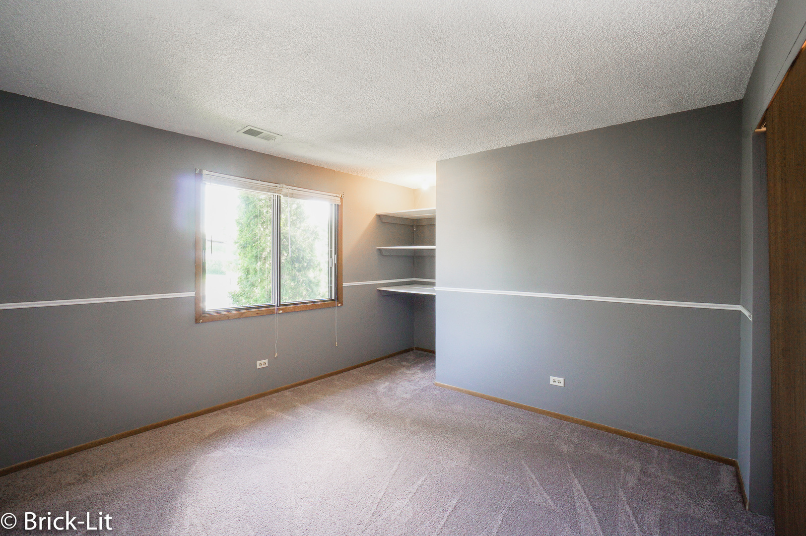 19444 Wolf Road, Unit 3 Mokena, IL 60448 - Photo 14 of 18 an empty room with windows