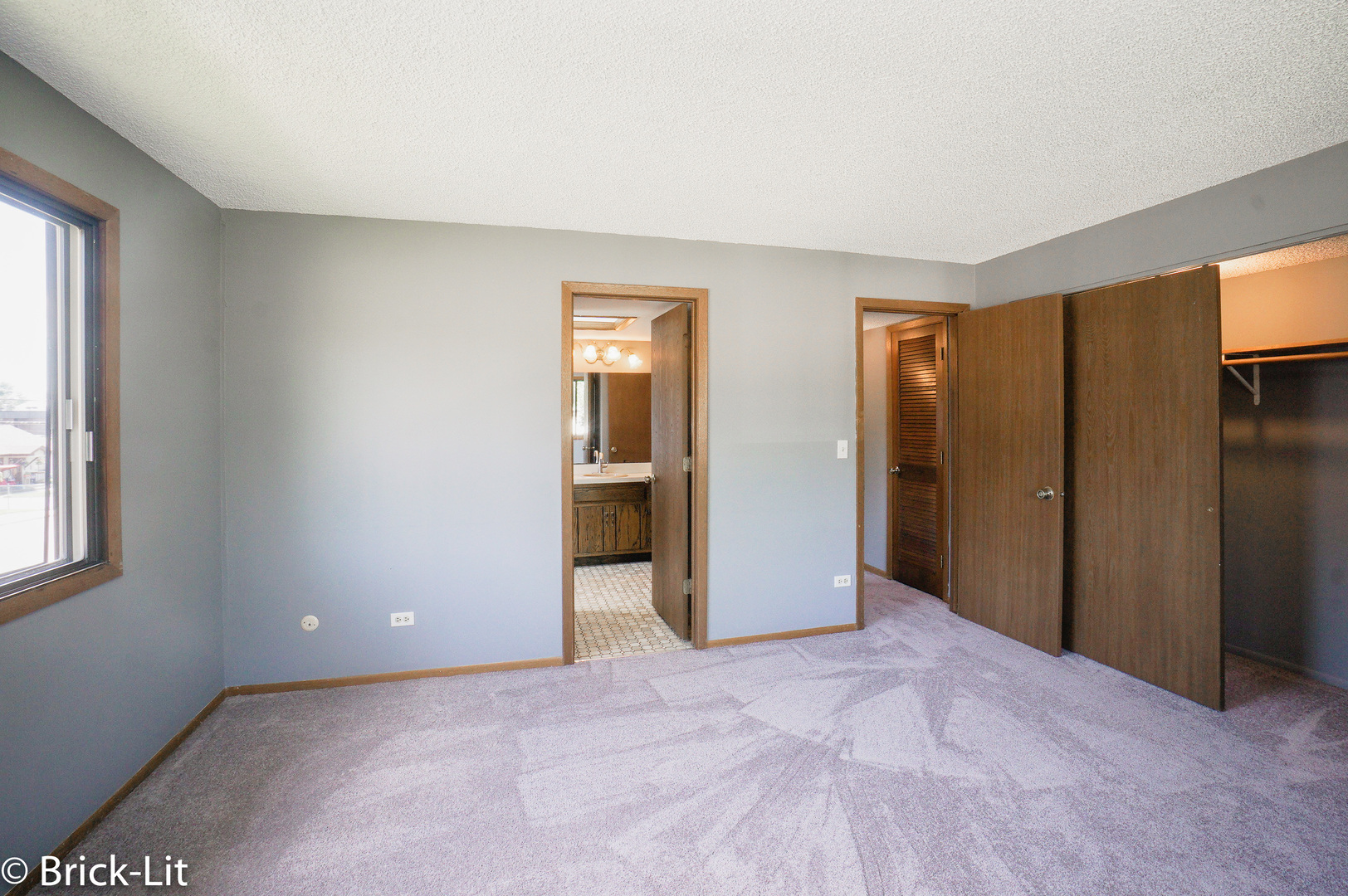 19444 Wolf Road, Unit 3 Mokena, IL 60448 - Photo 17 of 18 a view of a livingroom with a chandelier fan and windows