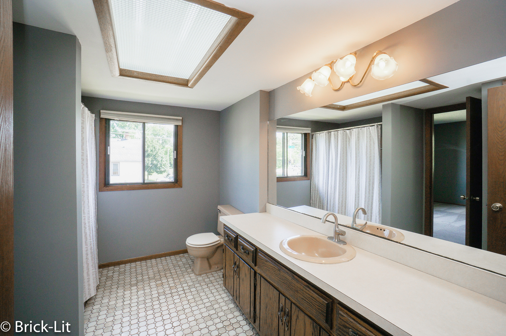 19444 Wolf Road, Unit 3 Mokena, IL 60448 - Photo 18 of 18 a bathroom with a sink and a mirror